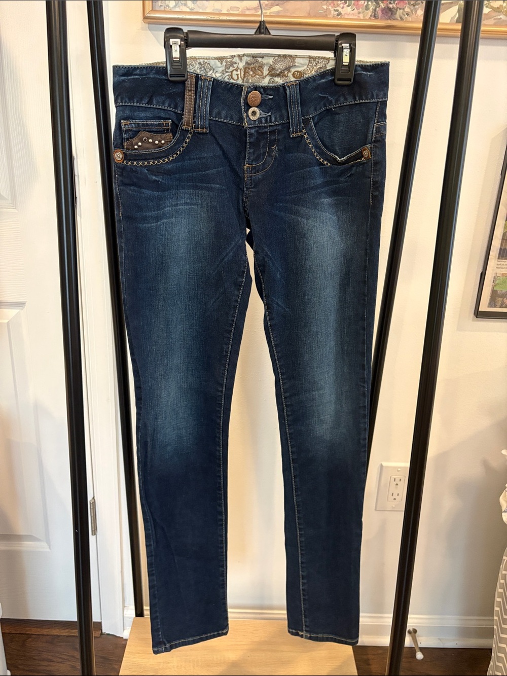 Guess Daredevil Line Women’s Dark Wash Skinny Jeans with Decorative Hardware.